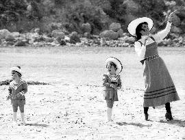 JOAN COLLINS with her children ALEXANDER and TARA NEWLEY on