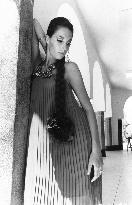 TRACY REED in a pleated tent dress     TRACY REED in a pleat