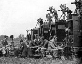 GAUMONT-BRITISH NEWS camera and sound recording crews