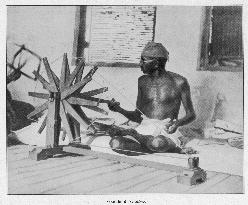 Mahatma Gandhi spinning at his wheel