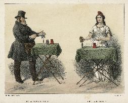 Man and woman magicians performing tricks at table