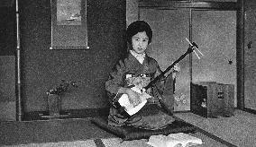 Japan - Music Teacher playing a Shamisen