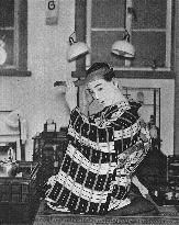 A Japanese actor dresses.