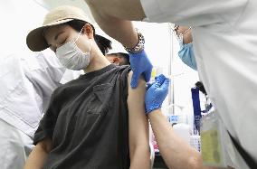 Japan starts vaccinating people aged 18 or older at state-run centers