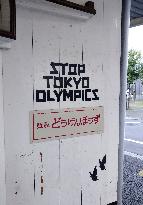 Anti-Olympic message on restaurant wall in Tokyo