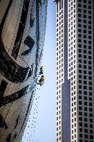 Workers clean the Museum of the Future - Dubai