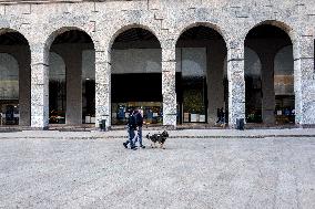 Empty streets and closed shops in Milan