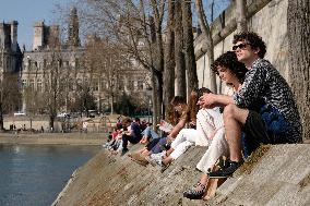 People Enjoying the Warm Weather Paris