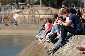 People Enjoying the Warm Weather Paris