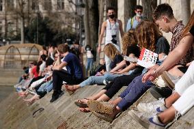 People Enjoying the Warm Weather Paris