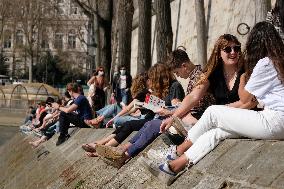 People Enjoying the Warm Weather Paris