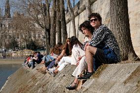 People Enjoying the Warm Weather Paris