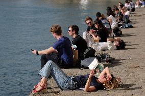 People Enjoying the Warm Weather Paris
