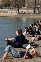 People Enjoying the Warm Weather Paris