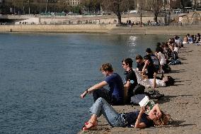 People Enjoying the Warm Weather Paris