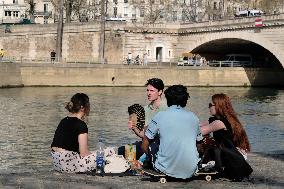 People Enjoying the Warm Weather Paris