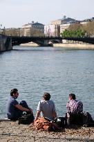 People Enjoying the Warm Weather Paris