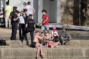 People Enjoying the Warm Weather Paris