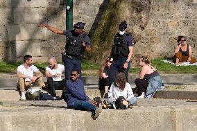 People Enjoying the Warm Weather Paris