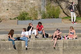 People Enjoying the Warm Weather Paris