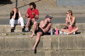People Enjoying the Warm Weather Paris