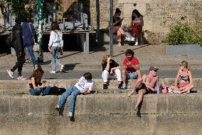 People Enjoying the Warm Weather Paris
