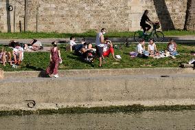 People Enjoying the Warm Weather Paris