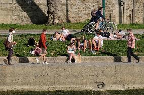 People Enjoying the Warm Weather Paris