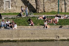 People Enjoying the Warm Weather Paris