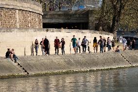 People Enjoying the Warm Weather Paris