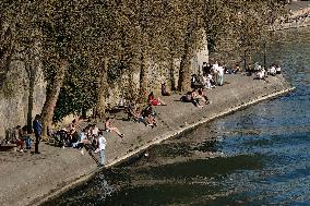 People Enjoying the Warm Weather Paris