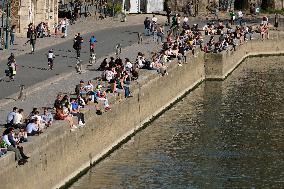 People Enjoying the Warm Weather Paris