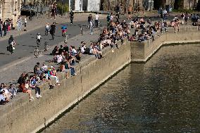 People Enjoying the Warm Weather Paris