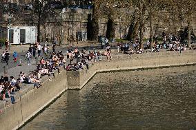 People Enjoying the Warm Weather Paris