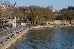 People Enjoying the Warm Weather Paris