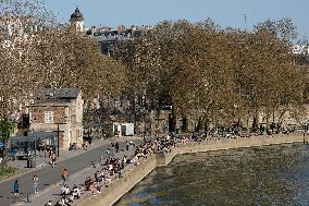 People Enjoying the Warm Weather Paris