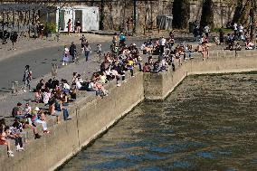 People Enjoying the Warm Weather Paris