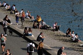 People Enjoying the Warm Weather Paris