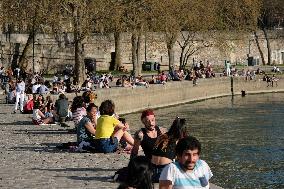 People Enjoying the Warm Weather Paris