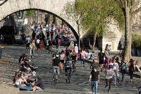 People Enjoying the Warm Weather Paris
