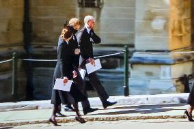 A Family Watching Prince Philip's Funeral On Tv