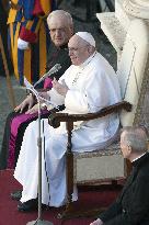 Pope Francis arrives for his weekly general audience