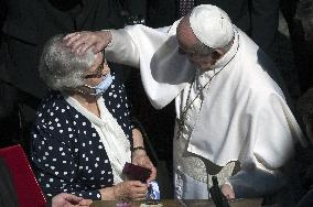 Pope Francis arrives for his weekly general audience