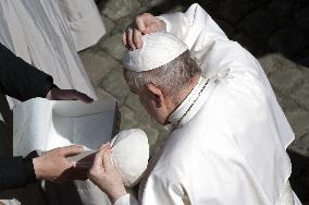 Pope Francis arrives for his weekly general audience