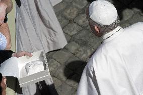 Pope Francis arrives for his weekly general audience