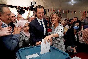President Bashar al-Assad And His Wife Vote - Douma