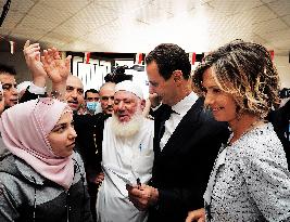 President Bashar al-Assad And His Wife Vote - Douma