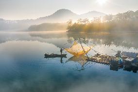A Man Fishing In Tuyen Lam Lake - Vietnam