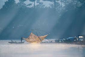 A Man Fishing In Tuyen Lam Lake - Vietnam