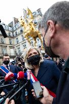 Marine Le Pen Lays Flowers To A Statue Of Joan of Arc - Paris